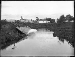 Awanui River, showing a barge used during swamp drainage