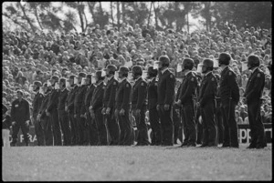 Policemen in riot helmets standing on Rugby Park, Hamilton, during the Springbok rugby tour - Photograph taken by Ian Mackley