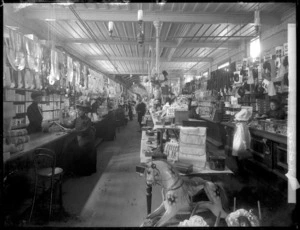 Inside The Economic drapery store, Wanganui; shows the section selling women's accessories, gloves, etc, with rocking horse in foreground