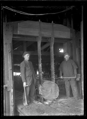 Two unidentified men working with a twin breaking down saw at Mokai for the Taupo Totara Timber Company