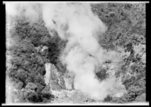 Narrow geothermal gorge with billowing steam from river in centre. `No. 145'