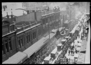 View of procession of cars and crowds in Willis Street during the funeral of Mother Mary Aubert