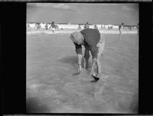 New Zealand soldier washing his socks in the sea at Baggush, Western Desert, during World War 2