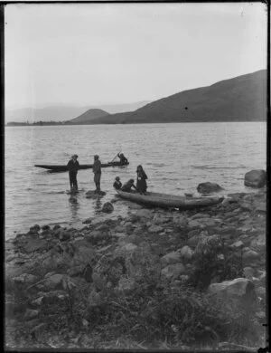 Maori children in canoes on Lake Taupo, near Tokaanu