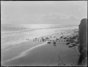 Two men walking on beach, New Plymouth, Taranaki