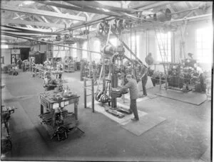 An engineering workshop with lathes and drills in use