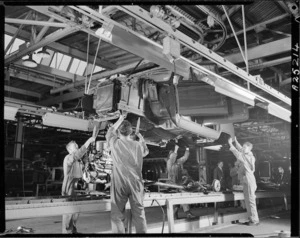 Body of a Mk 1 Consul being lowered on to its chassis, Ford Motor Company, Lower Hutt - Photograph taken by Edward Christensen