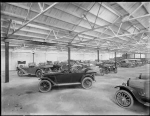 Motor cars assembled in shed, CH number plates