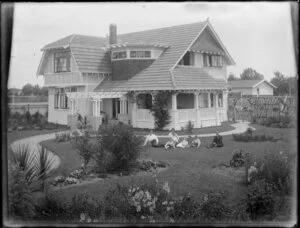 Family gathered on lawn in front "Myola", Mr W G Jaeger's residence, Nelson Street, Hastings