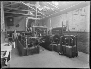 Engine room of an unidentified factory, showing machinery