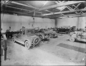 Cars being repaired in a garage or service station