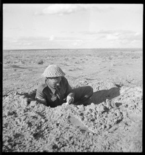 World War 2 New Zealand signaller repairing a communication line, Tripoli, Libya - Photograph taken by H Paton