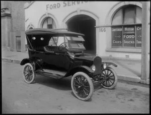 Model T Ford motorcar in front of the business premises of the Canterbury Motor Company Ltd, Christchurch