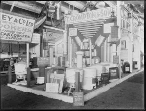 Display at an exposition of items manufactured by T Crompton & Sons of Christchurch, with baths, basins, coppers, pipes guttering etc.