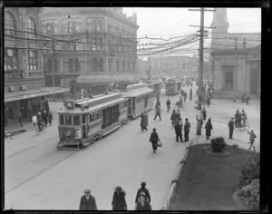 Scene in Christchurch, looking toward Cathedral Square, with trams, pedestrians, and cyclists on Colombo Street