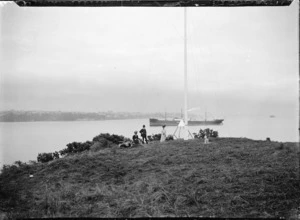 People gathered round the flagstaff at Northcote, Auckland