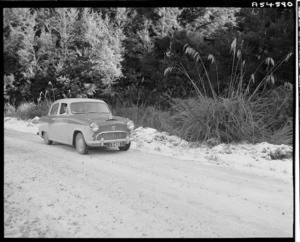 Austin car on the highway between Waikaremoana and Rotorua - Photograph taken by W Walker