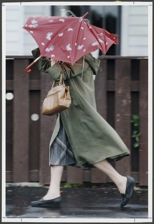 Woman battling with the wind along Muritai Road, Eastbourne - Photograph taken by Phil Reid