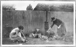 Swan, Joanne, fl 1978 :Photograph of Miss Sheila McLeod and her mother, cooking after the Hawke's Bay earthquake