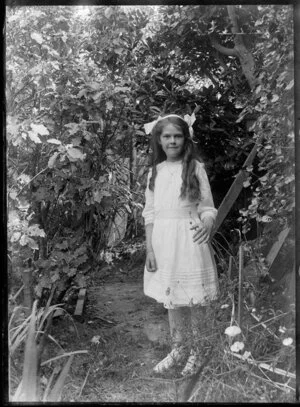 Portrait of a young girl in a garden