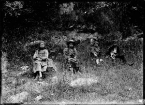 Four children on a bank