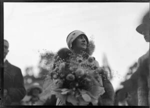 Unidentified woman with flowers during Royal Tour