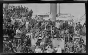 Crowd watching boxing match on ship