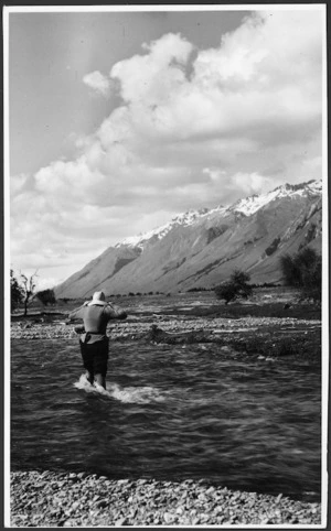 Woman crossing the Hunter River, Otago