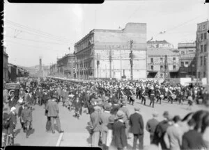 Brass band leading military parade, Wellington