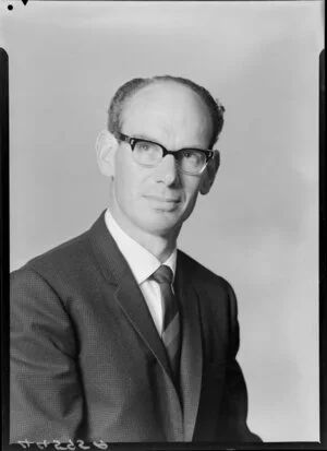 Unidentified bespectacled man in suit