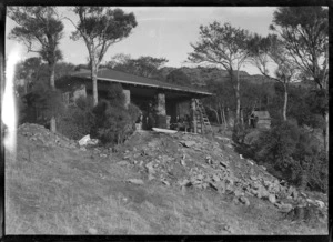 Stone house with pillars at the front of a deep verandah