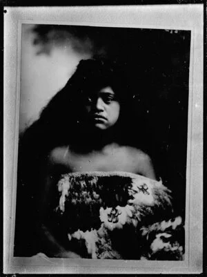Copy photograph of a photograph of a young Maori woman in a kahu huruhuru