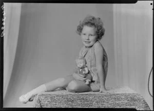 Unidentified girl with doll [daughter of Mr R.W. Jones]