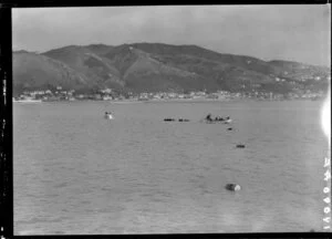 Two boats involved in laying out floating barrels, Lyall Bay, Wellington