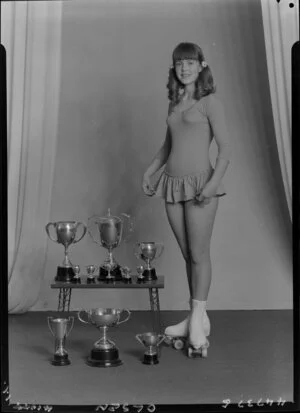 Miss Olsen with roller skating trophies