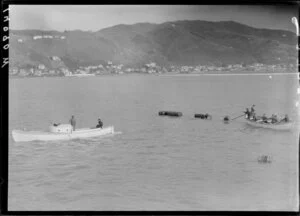 Two boats involved in laying out floating barrels, Lyall Bay, Wellington