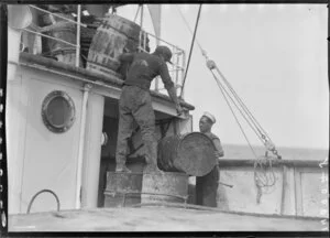 Unidentified men with barrels on deck of Tutanekai