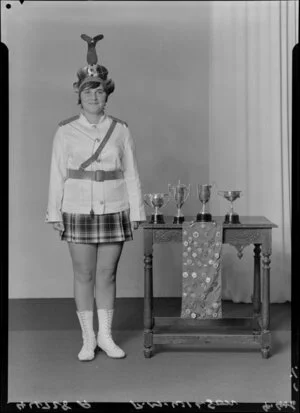 Miss Wilson with highland dancing trophies