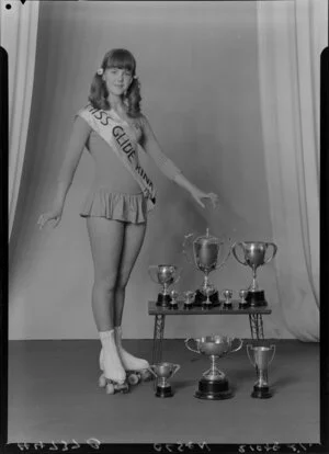 Miss Olsen with roller skating trophies