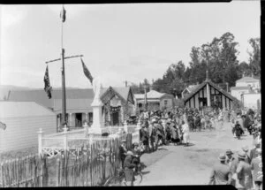 Gathering outside wharenui & other Maori buildings