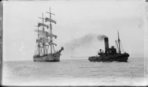 Ship Tonawanda being towed by the tug Te Awhina, probably in Auckland Harbour, circa 1920s