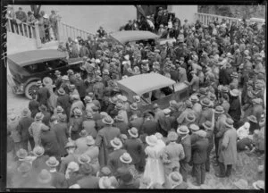 Cars surrounded by crowd in front of building, opening of Mangahao Hydro Power Station