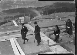 Official party walking around site of new building, 1926