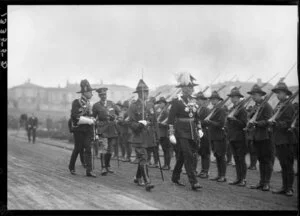 Governor General Sir Charles Fergusson inspecting troops, Parliament Buildings, Wellington
