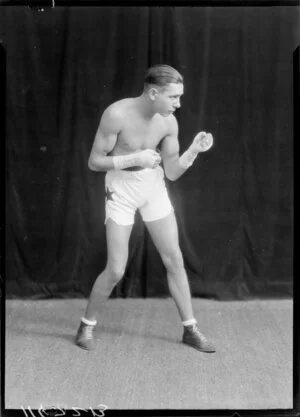 Unidentified man posing in boxing trunks