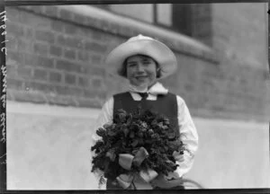 Unidentified schoolgirl with bouquet, Marsden School, Wellington