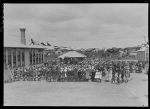 Crowd at ceremony outside school building, opening of Mangahao Hydro Power Station