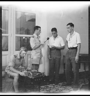 Repatriated New Zealand prisoners of war recording messages for family back home, Helwan, Egypt, during World War 2 - Photograph taken by George Bull