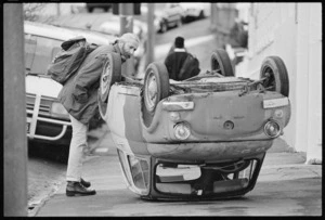 Fiat Bambina car on its roof, Tasman Street, Mount Cook, Wellington - Photograph taken by Phil Reid