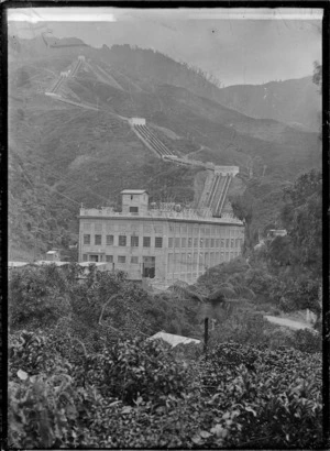 Mangahao Power Station, exterior view of the power station and penstocks on the hill above, 1924